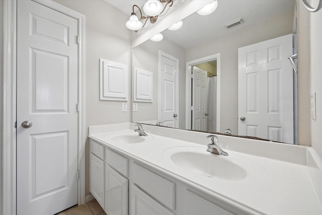 9110 Kinnel Ln, Tomball, TX 77375 - bathroom with double vanity and tile patterned flooring