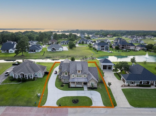 10887 Decatur St, Willis, TX 77318 - aerial view at dusk of property boundaries highlighted, a water view, and a residential view