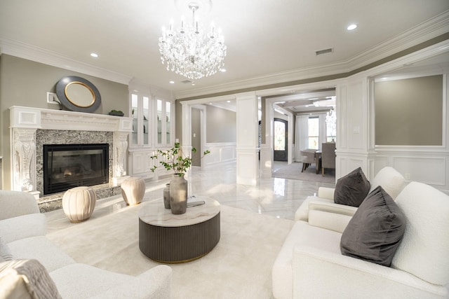 10887 Decatur St, Willis, TX 77318 - living area featuring a decorative wall, ornamental molding, a chandelier, recessed lighting, and a wainscoted wall