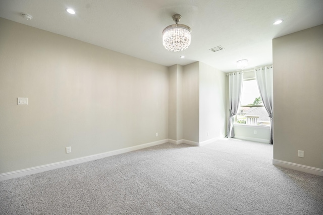 10887 Decatur St, Willis, TX 77318 - empty room featuring carpet floors, baseboards, a chandelier, and recessed lighting