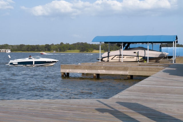 10887 Decatur St, Willis, TX 77318 - dock featuring a water view and boat lift