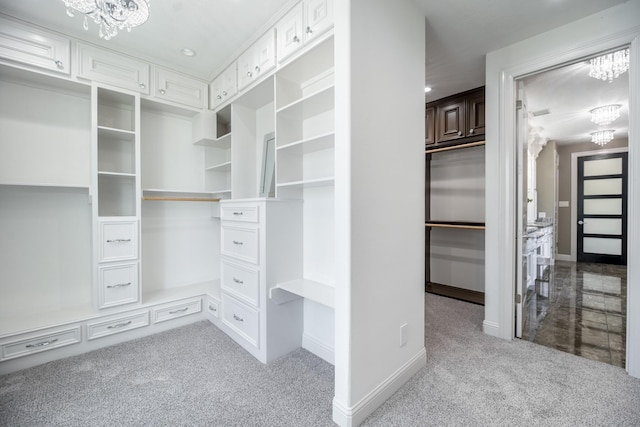 10887 Decatur St, Willis, TX 77318 - walk in closet with a chandelier and carpet floors