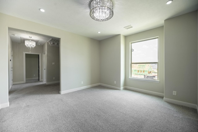 10887 Decatur St, Willis, TX 77318 - carpeted empty room featuring a chandelier, baseboards, and recessed lighting
