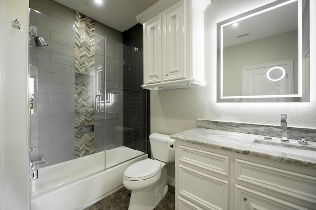 10887 Decatur St, Willis, TX 77318 - full bathroom featuring vanity, toilet, and bath / shower combo with glass door