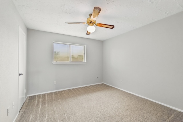 10119 Peachridge Dr, Houston, TX 77070 - carpeted empty room with a ceiling fan, baseboards, and a textured ceiling