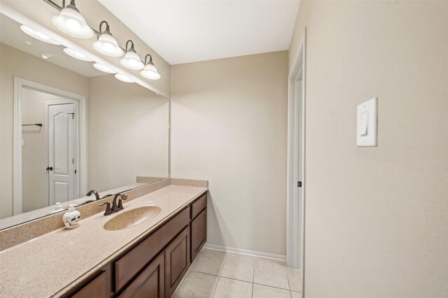 13803 Oak Fair Bnd, Cypress, TX 77429 - bathroom with vanity, tile patterned floors, and baseboards