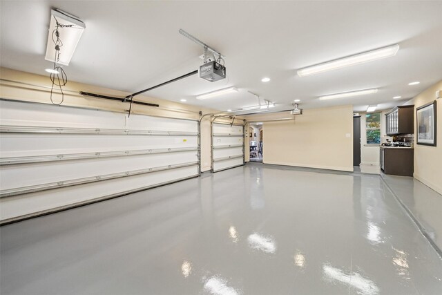 13803 Oak Fair Bnd, Cypress, TX 77429 - garage featuring a garage door opener