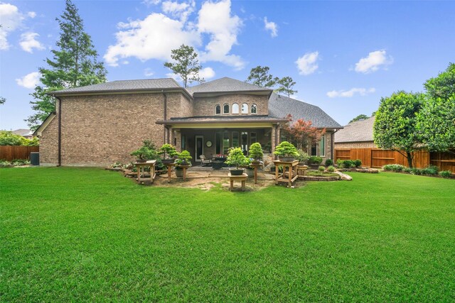 13803 Oak Fair Bnd, Cypress, TX 77429 - rear view of house with brick siding and a patio