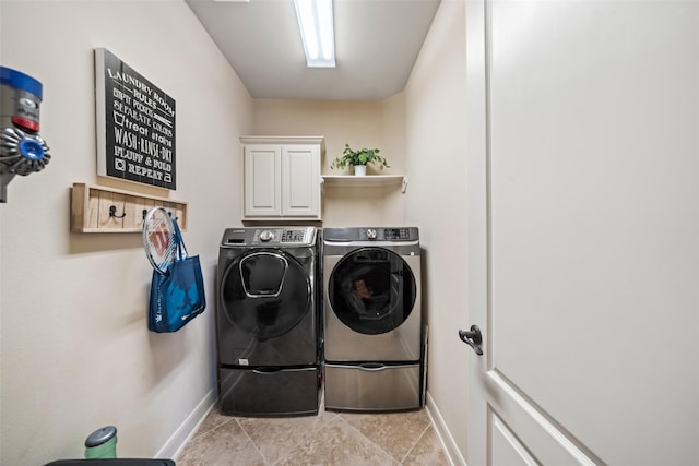 13803 Oak Fair Bnd, Cypress, TX 77429 - washroom with baseboards, washer and clothes dryer, and cabinet space