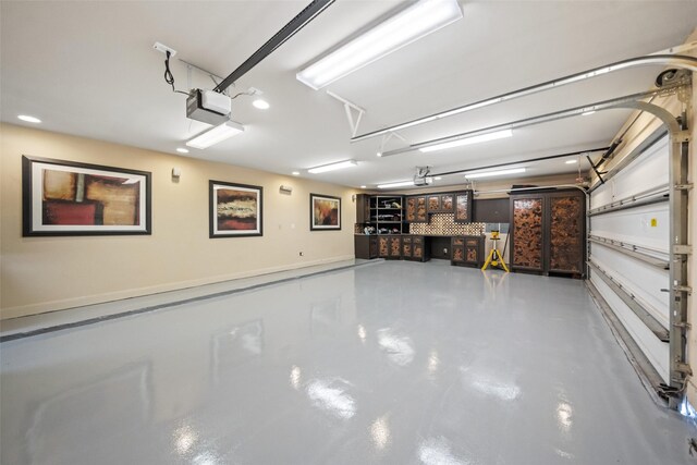 13803 Oak Fair Bnd, Cypress, TX 77429 - garage featuring a garage door opener, recessed lighting, and baseboards