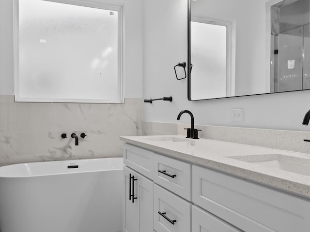 2318 Mcilhenny St, Houston, TX 77004 - full bath with double vanity, a freestanding bath, and a shower