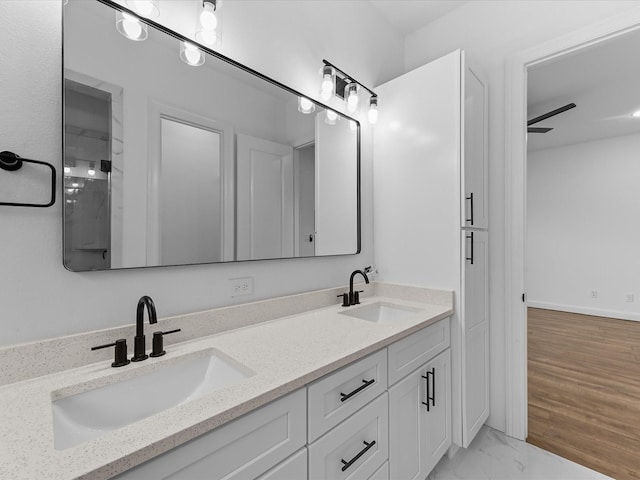 2318 Mcilhenny St, Houston, TX 77004 - bathroom featuring double vanity and marble look tiles