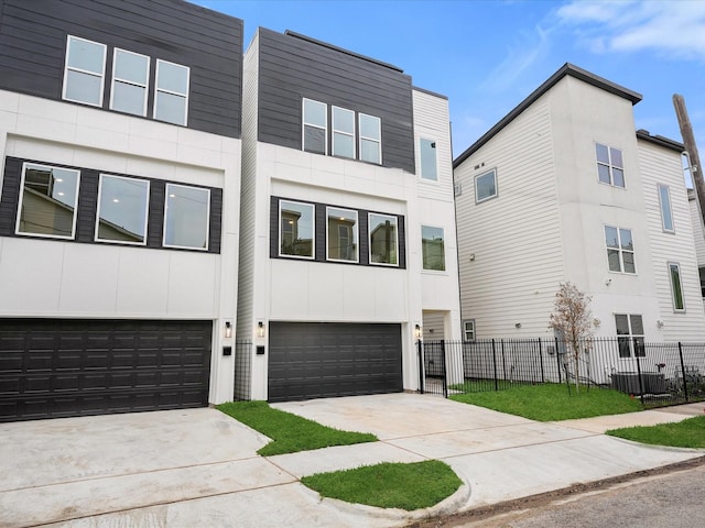 2318 Mcilhenny St, Houston, TX 77004 - view of property with an attached garage and concrete driveway