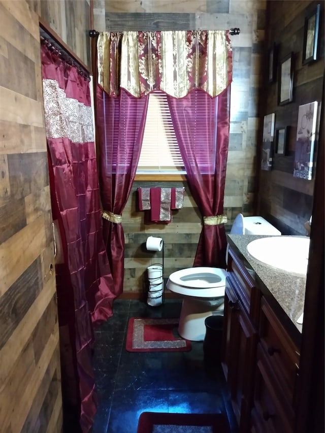 330 Spell St, Houston, TX 77022 - full bath featuring vanity, toilet, wood walls, a shower with curtain, and a bidet