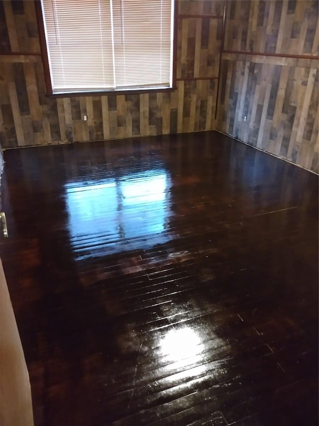 330 Spell St, Houston, TX 77022 - spare room with wood-type flooring and wooden walls