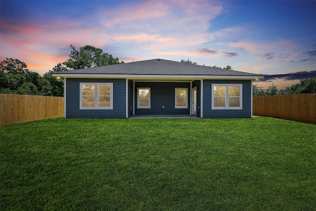 3730 Nathan St, Beaumont, TX 77708 - back of house at dusk featuring a patio and a fenced backyard