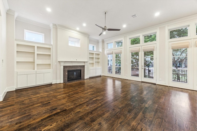 1701 Wrenwood Lks, Houston, TX 77043 - unfurnished living room featuring crown molding, a ceiling fan, a premium fireplace, healthy amount of natural light, and recessed lighting