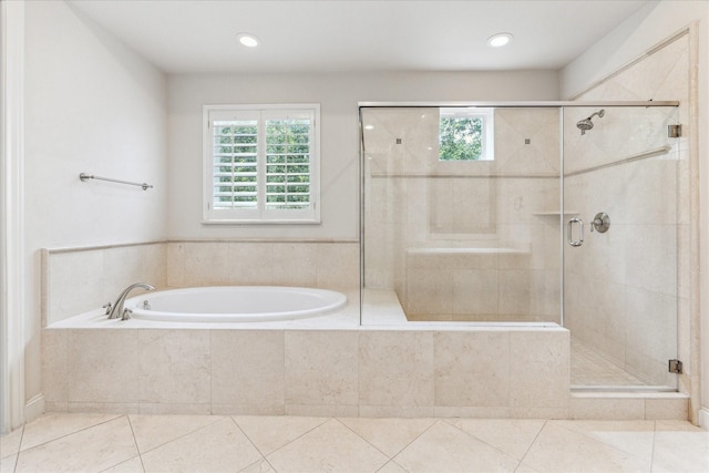 1701 Wrenwood Lks, Houston, TX 77043 - full bathroom featuring plenty of natural light, a bath, tile patterned floors, a stall shower, and recessed lighting