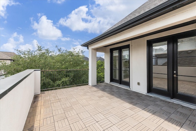 1701 Wrenwood Lks, Houston, TX 77043 - view of patio featuring french doors and a balcony