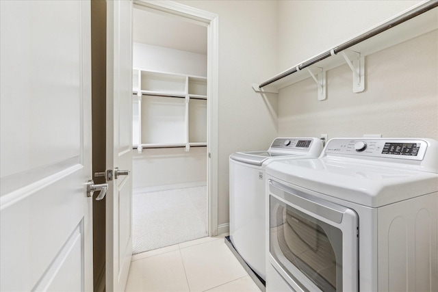 1701 Wrenwood Lks, Houston, TX 77043 - laundry room featuring independent washer and dryer and light tile patterned floors