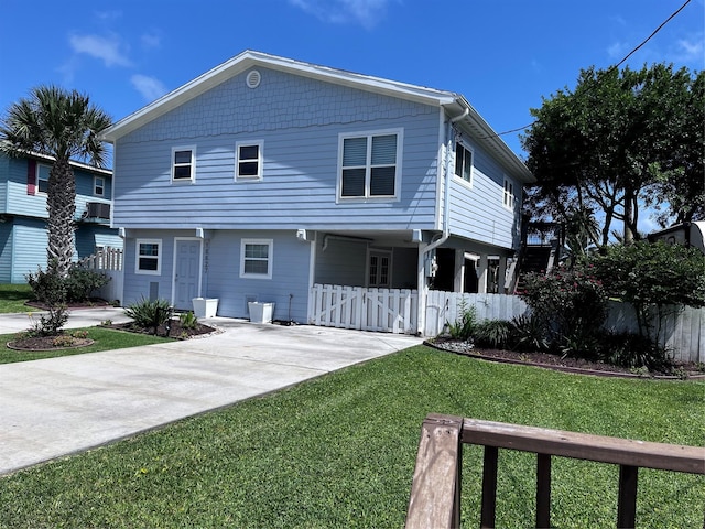 16627 Bermuda Way, Jamaica Beach, TX 77554 - back of house with concrete driveway and a gate