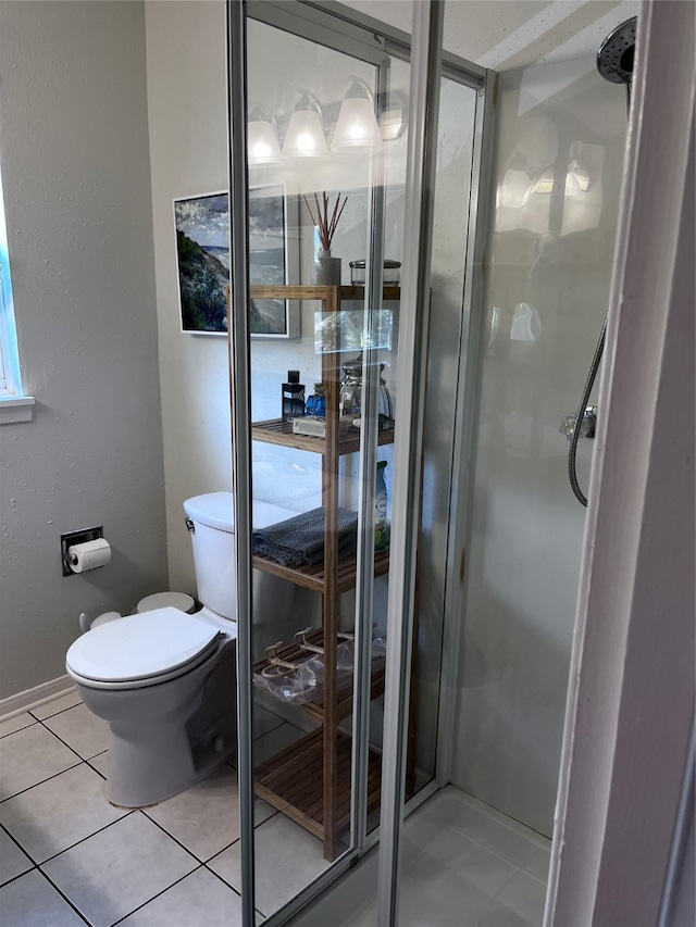 16627 Bermuda Way, Jamaica Beach, TX 77554 - full bathroom with tile patterned floors, a shower stall, toilet, and baseboards
