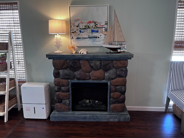 16627 Bermuda Way, Jamaica Beach, TX 77554 - detailed view of wood finished floors, baseboards, and a stone fireplace