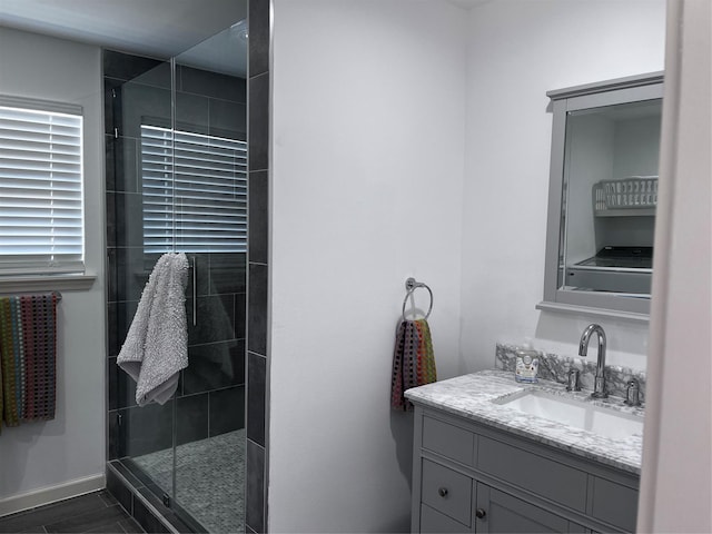 16627 Bermuda Way, Jamaica Beach, TX 77554 - bathroom with vanity, a stall shower, and baseboards
