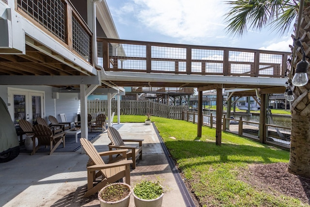 16627 Bermuda Way, Jamaica Beach, TX 77554 - view of patio / terrace featuring a water view and french doors