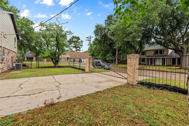 8707 Wind Side Dr, Houston, TX 77040 - view of concrete driveway with a gated entry and a gate