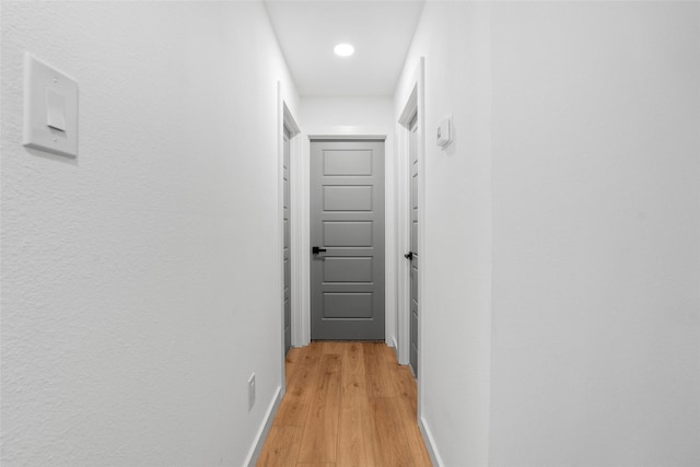 8707 Wind Side Dr, Houston, TX 77040 - corridor with light wood-type flooring, baseboards, and recessed lighting