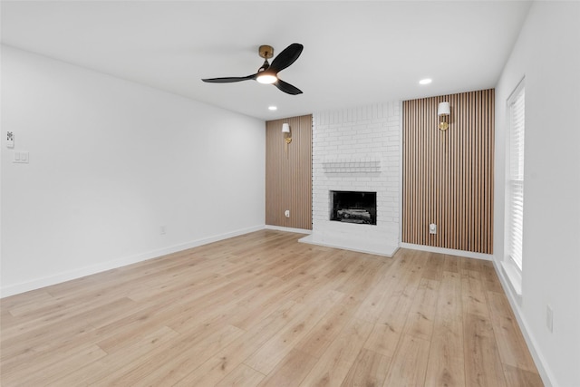 8707 Wind Side Dr, Houston, TX 77040 - unfurnished living room featuring ceiling fan, light wood-style flooring, a brick fireplace, recessed lighting, and baseboards