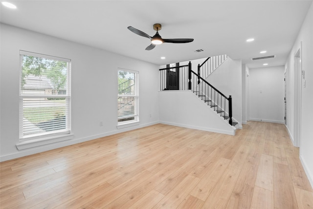 8707 Wind Side Dr, Houston, TX 77040 - unfurnished living room with stairway, a ceiling fan, light wood finished floors, baseboards, and recessed lighting