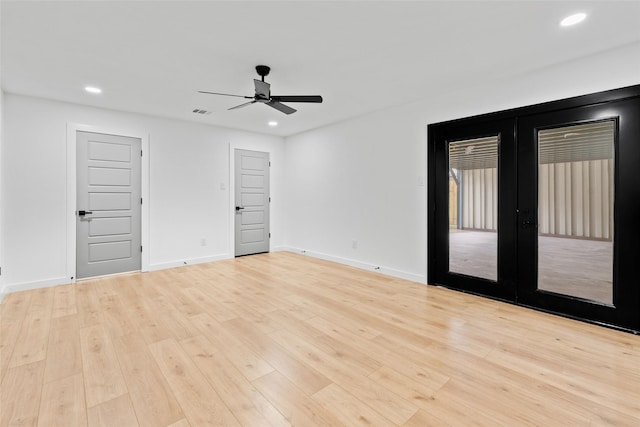 8707 Wind Side Dr, Houston, TX 77040 - spare room with a ceiling fan, recessed lighting, light wood-style floors, baseboards, and french doors