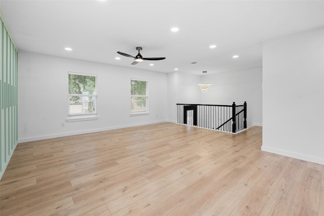 8707 Wind Side Dr, Houston, TX 77040 - empty room with recessed lighting, light wood-type flooring, a ceiling fan, and baseboards