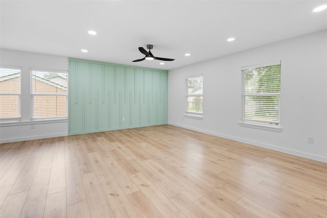 8707 Wind Side Dr, Houston, TX 77040 - spare room featuring light wood-type flooring, baseboards, a ceiling fan, and recessed lighting