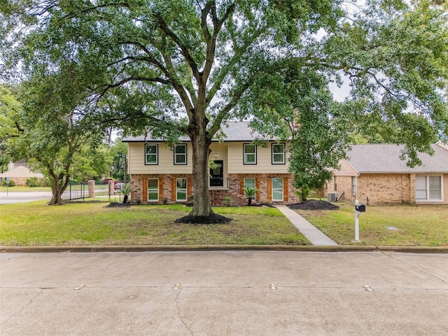 8707 Wind Side Dr, Houston, TX 77040 - raised ranch featuring brick siding and central AC