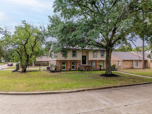 8707 Wind Side Dr, Houston, TX 77040 - bi-level home featuring brick siding