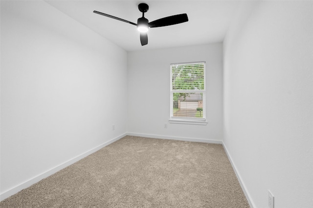 8707 Wind Side Dr, Houston, TX 77040 - empty room featuring light colored carpet, a ceiling fan, and baseboards