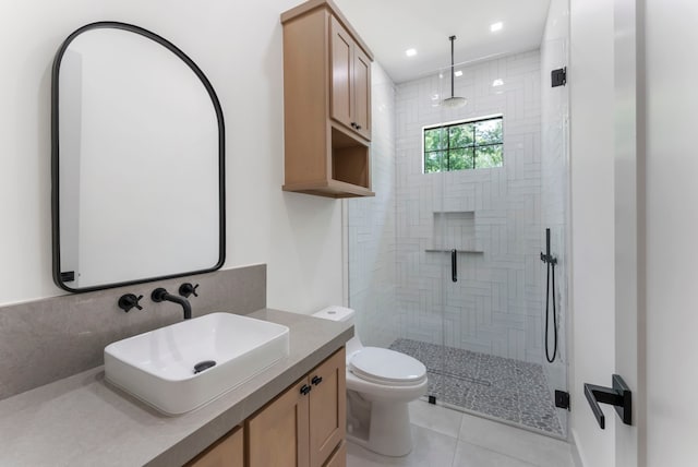 15086 Dewberry Ln, Conroe, TX 77302 - full bathroom with a tile shower, vanity, toilet, tile patterned floors, and recessed lighting