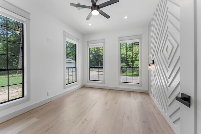 15086 Dewberry Ln, Conroe, TX 77302 - unfurnished room with baseboards, light wood-type flooring, healthy amount of natural light, and recessed lighting
