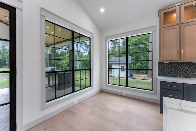 15086 Dewberry Ln, Conroe, TX 77302 - unfurnished dining area featuring light wood-style floors, vaulted ceiling, recessed lighting, and baseboards
