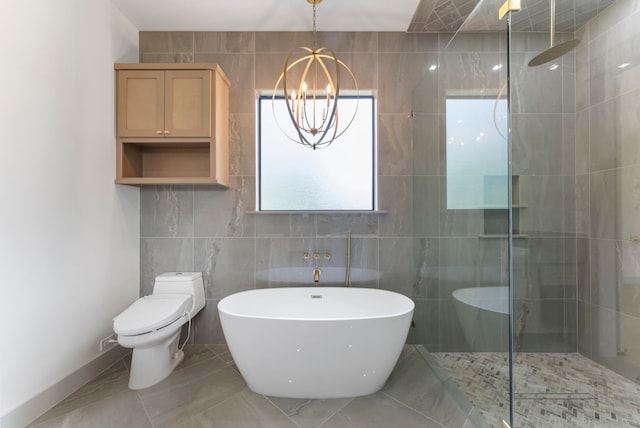 15086 Dewberry Ln, Conroe, TX 77302 - bathroom featuring tiled shower, a soaking tub, tile walls, a chandelier, and toilet