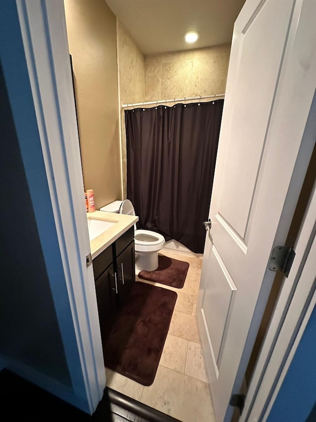 1613 Bonner St, Houston, TX 77007 - bathroom with toilet, vanity, a shower with shower curtain, recessed lighting, and stone finish floors