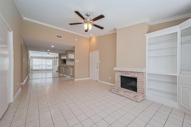 2110 Wilcrest Dr Unit 236, Houston, TX 77042 - unfurnished living room with ceiling fan, light tile patterned flooring, crown molding, a brick fireplace, and baseboards