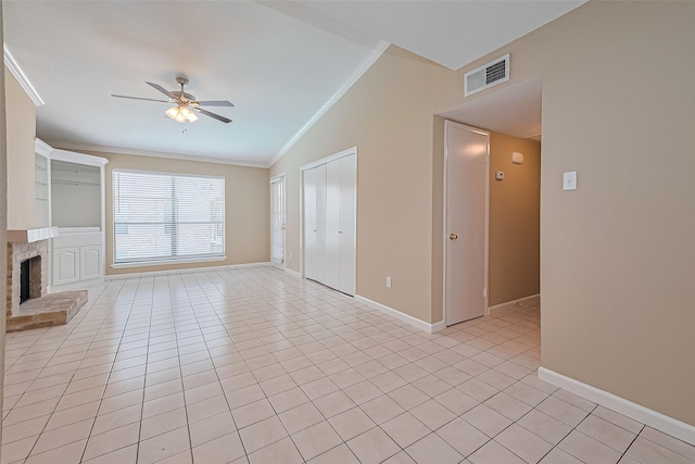 2110 Wilcrest Dr Unit 236, Houston, TX 77042 - unfurnished living room featuring lofted ceiling, ornamental molding, a ceiling fan, light tile patterned floors, and a fireplace