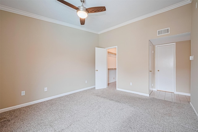 2110 Wilcrest Dr Unit 236, Houston, TX 77042 - unfurnished bedroom featuring carpet flooring, ornamental molding, baseboards, a spacious closet, and ceiling fan