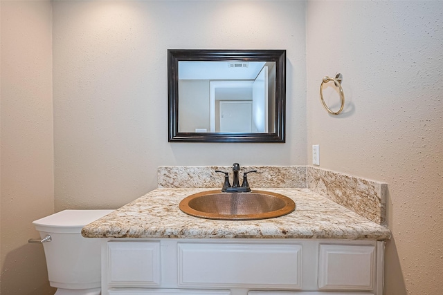 2110 Wilcrest Dr Unit 236, Houston, TX 77042 - bathroom featuring toilet and vanity
