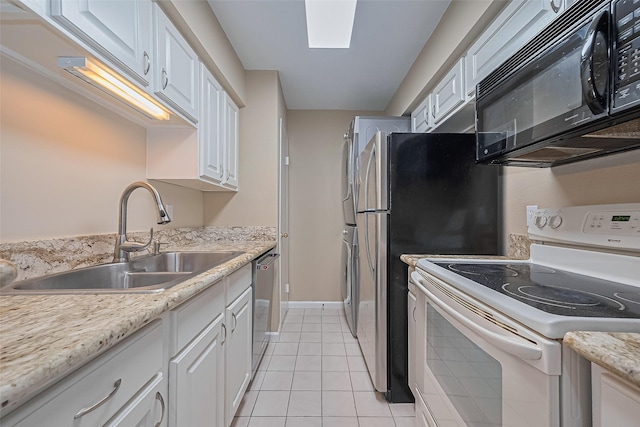 2110 Wilcrest Dr Unit 236, Houston, TX 77042 - kitchen featuring white electric range oven, black microwave, a sink, stainless steel dishwasher, and white cabinets