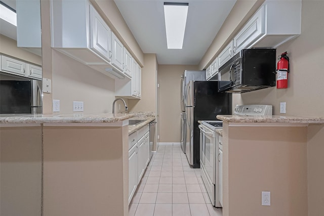 2110 Wilcrest Dr Unit 236, Houston, TX 77042 - kitchen with appliances with stainless steel finishes, a sink, white cabinets, and light tile patterned flooring